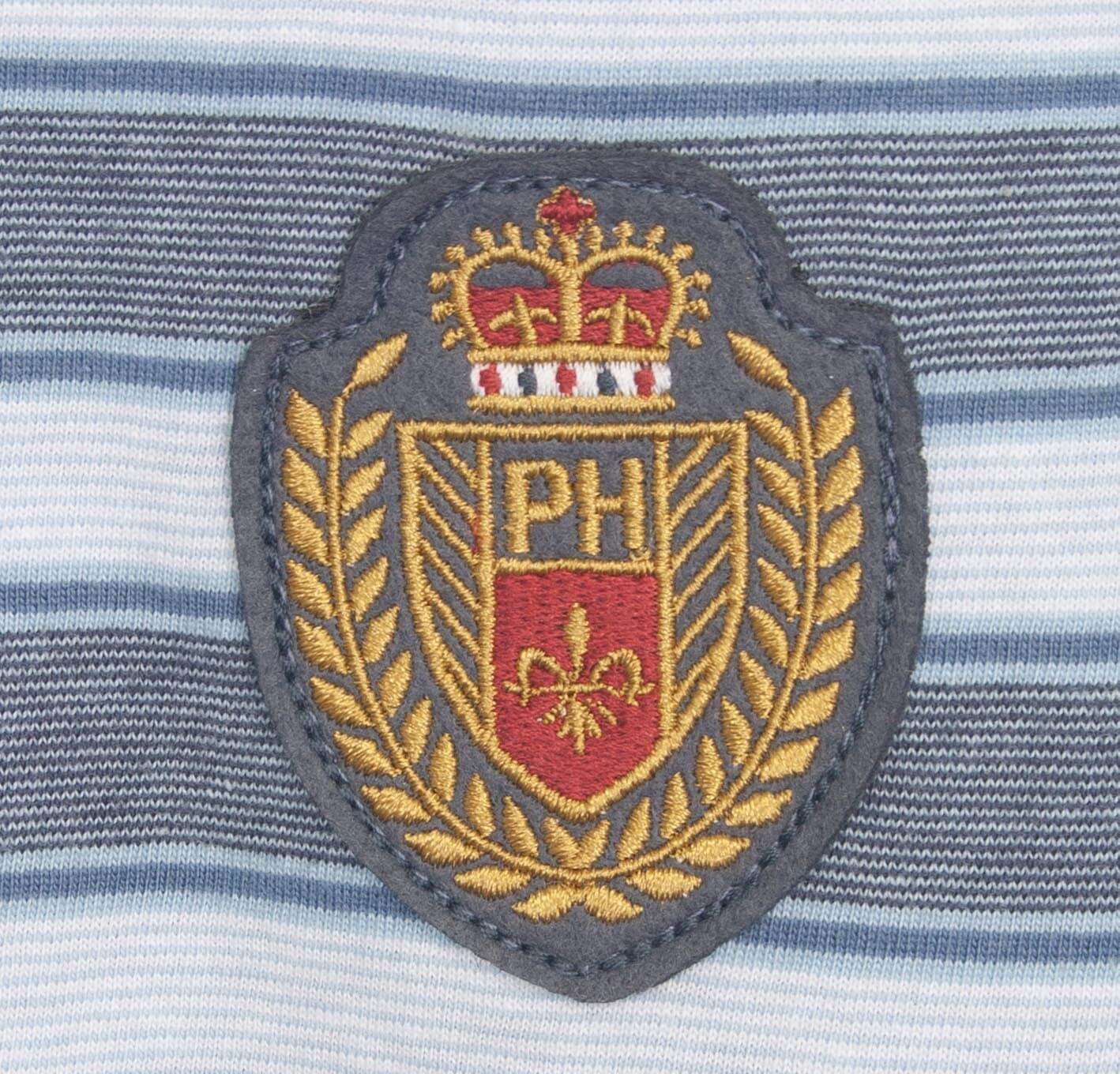 Geborduurd embleem op gestreepte stof, met 'NPH' logo, kroon en heraldisch schild in goud en rood