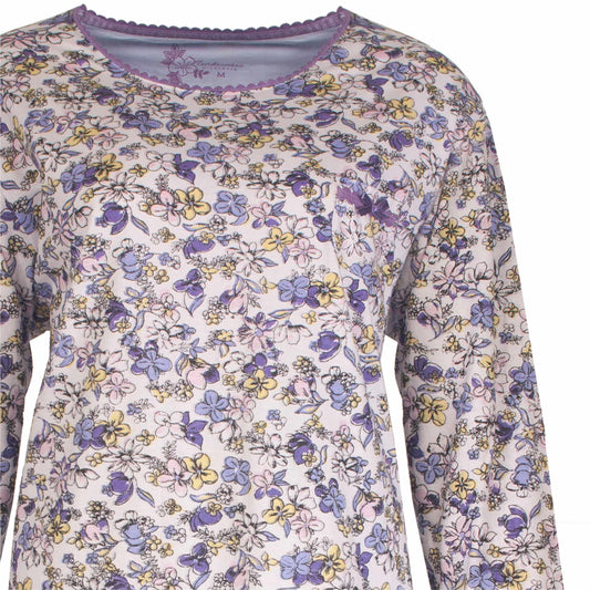 Lichtblauwe pyjama top met paarse, gele en roze bloemetjesprint en paarse halsboord