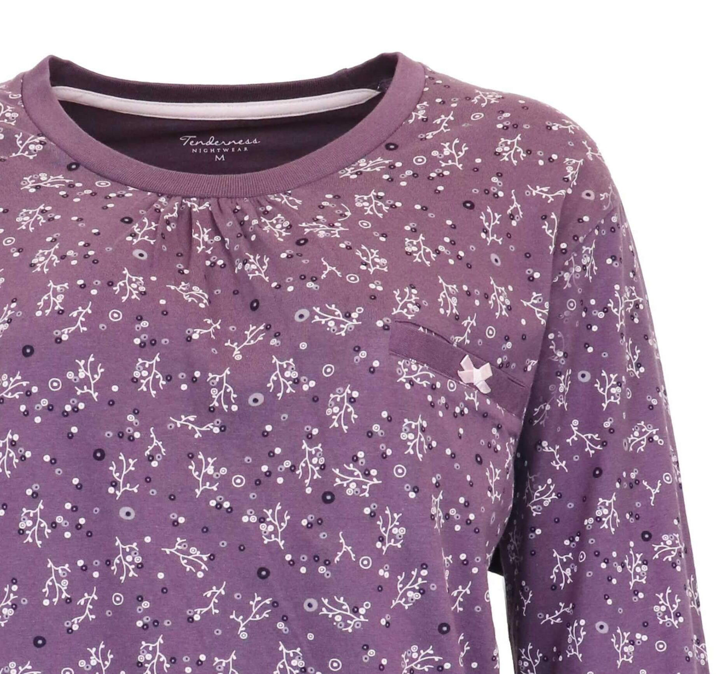 Donkerpaarse kamet witte bloemenprint, ronde hals en lange mouwen. Gemaakt van katoen voor comfort.