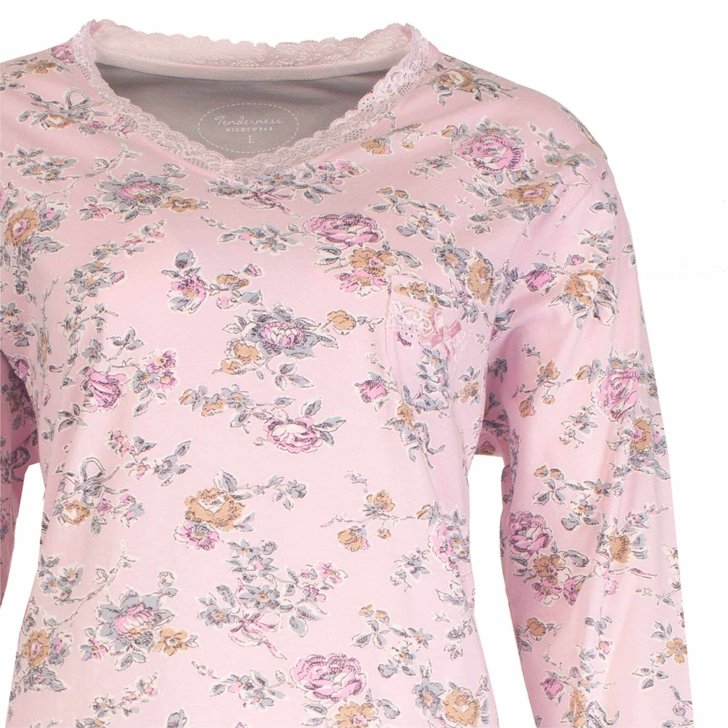 Roze pyjama bovenstuk met lange mouwen, versierd met kleine bloemetjes in roze, geel en grijs tinten.