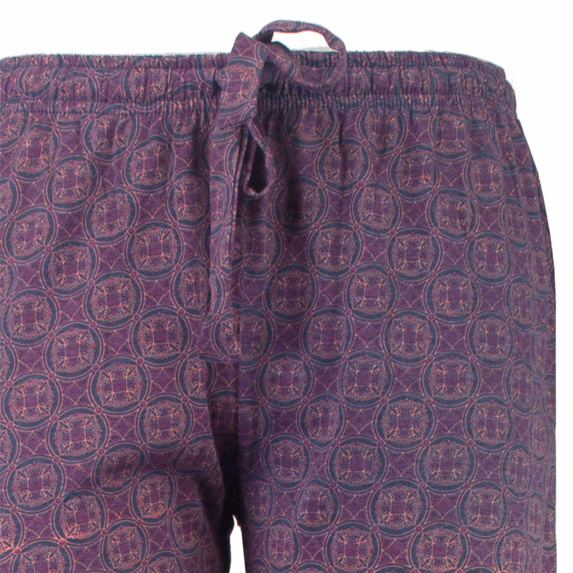 Blauwe pyjamabroek met paars patroon van cirkels en geometrische vormen, elastische tailleband met koord