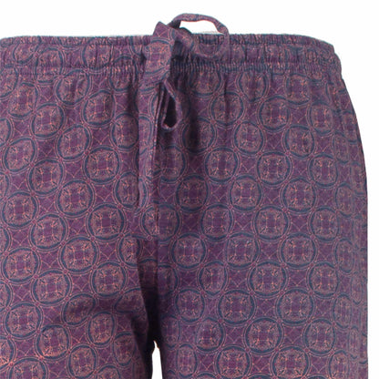 Blauwe pyjamabroek met paars patroon van cirkels en geometrische vormen, elastische tailleband met koord