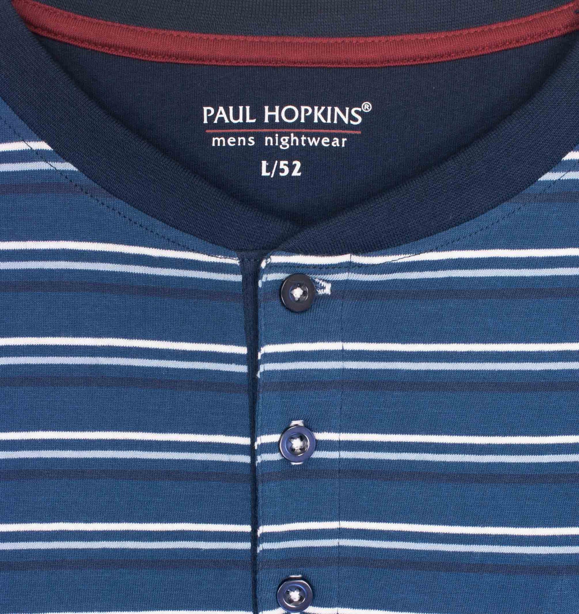 Blauwe gestreepte hmet polo sluiting, lange mouwen en Paul Hopkins logo op de borstzak