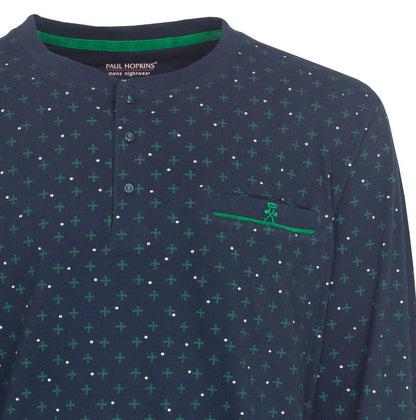 Blauw katoenen pyjama met groen bloemenpatroon en witte stippen, polosluiting en borstzakje met geborduurd logo