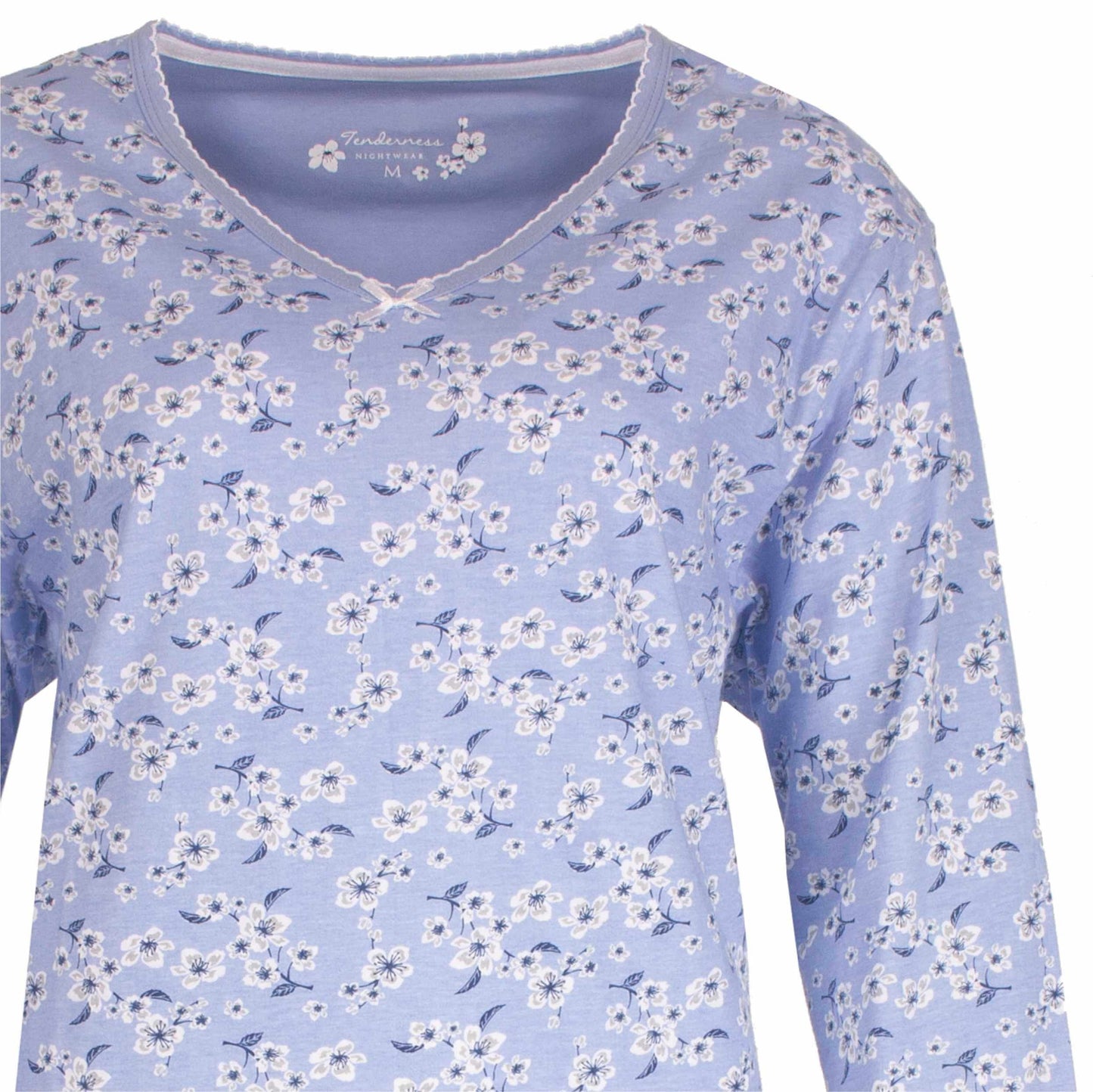 Lichtblauwe pyjama top met witte bloemetjes print en lange mouwen, V-hals met kant afwerking